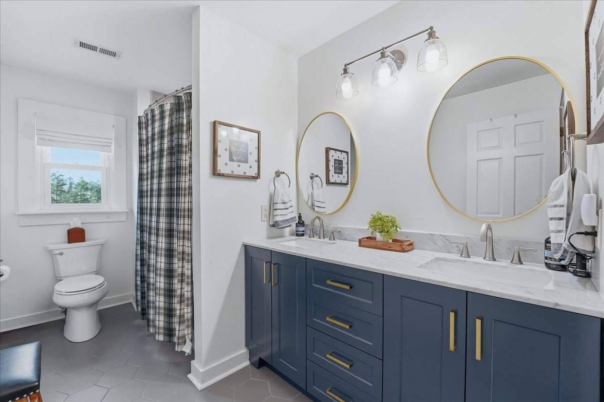 2254 Osburn Road Arrington, TN 37014 - Photo 30 of 55 a bathroom with a toilet a sink and a mirror