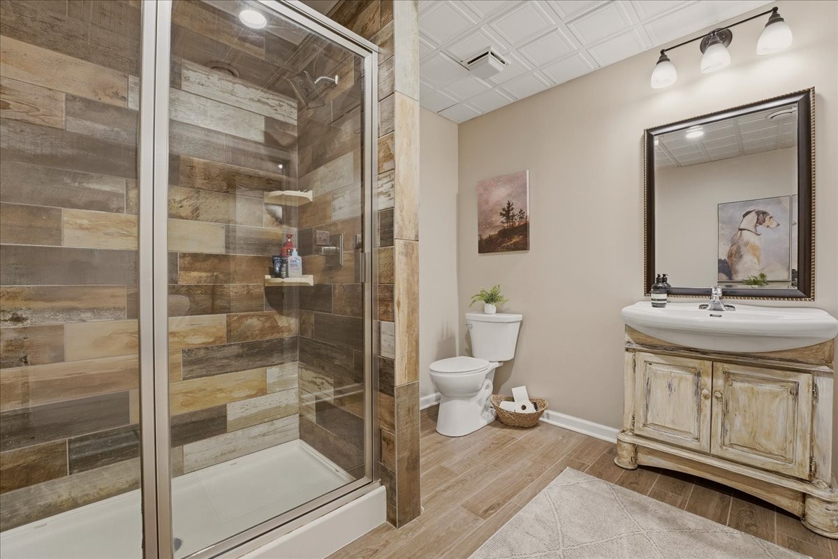 2254 Osburn Road Arrington, TN 37014 - Photo 39 of 55 a bathroom with a toilet a sink and shower