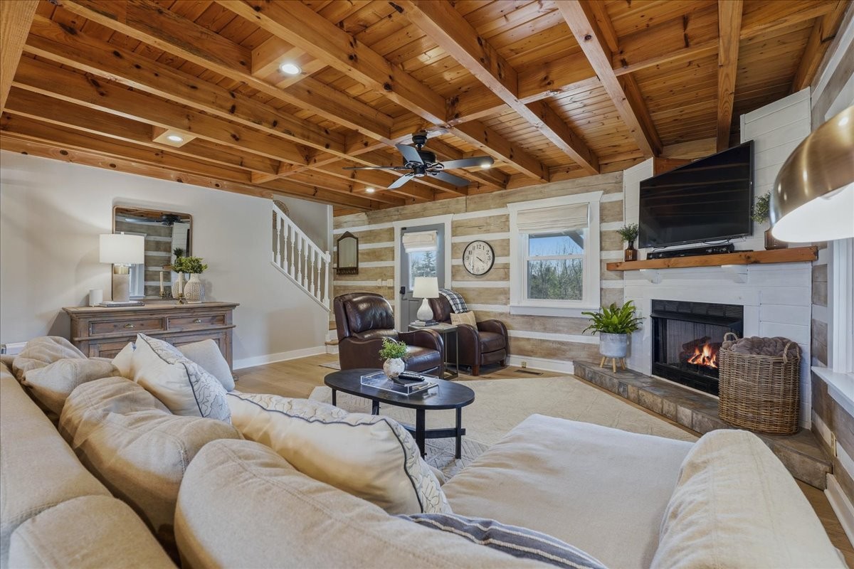 2254 Osburn Road Arrington, TN 37014 - Photo 10 of 55 a living room with furniture a fireplace and a flat screen tv