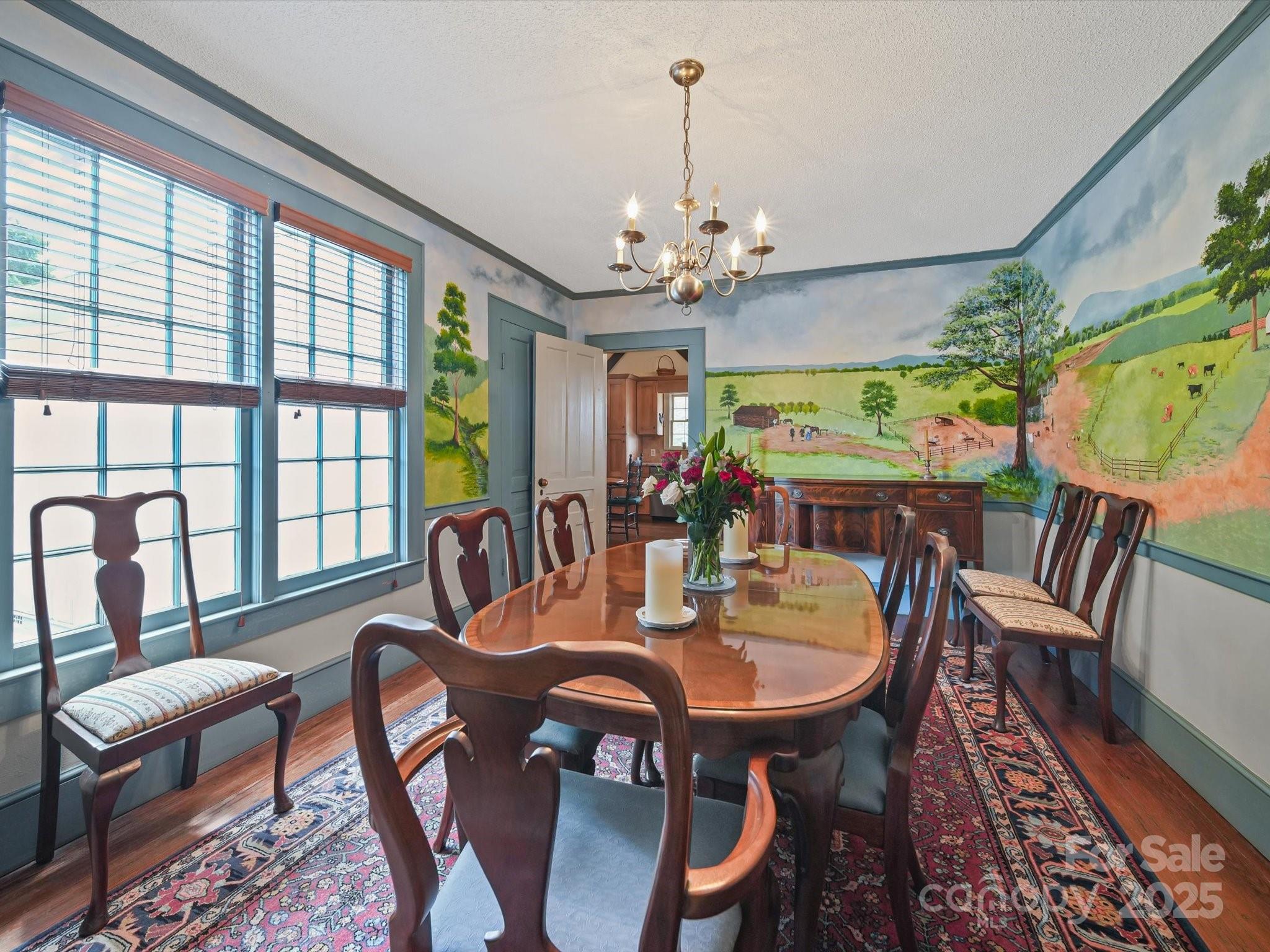 16801 Randalls Ferry Road Norwood, NC 28128 - Photo 14 of 48 a view of a dining room with furniture a chandelier and wooden floor