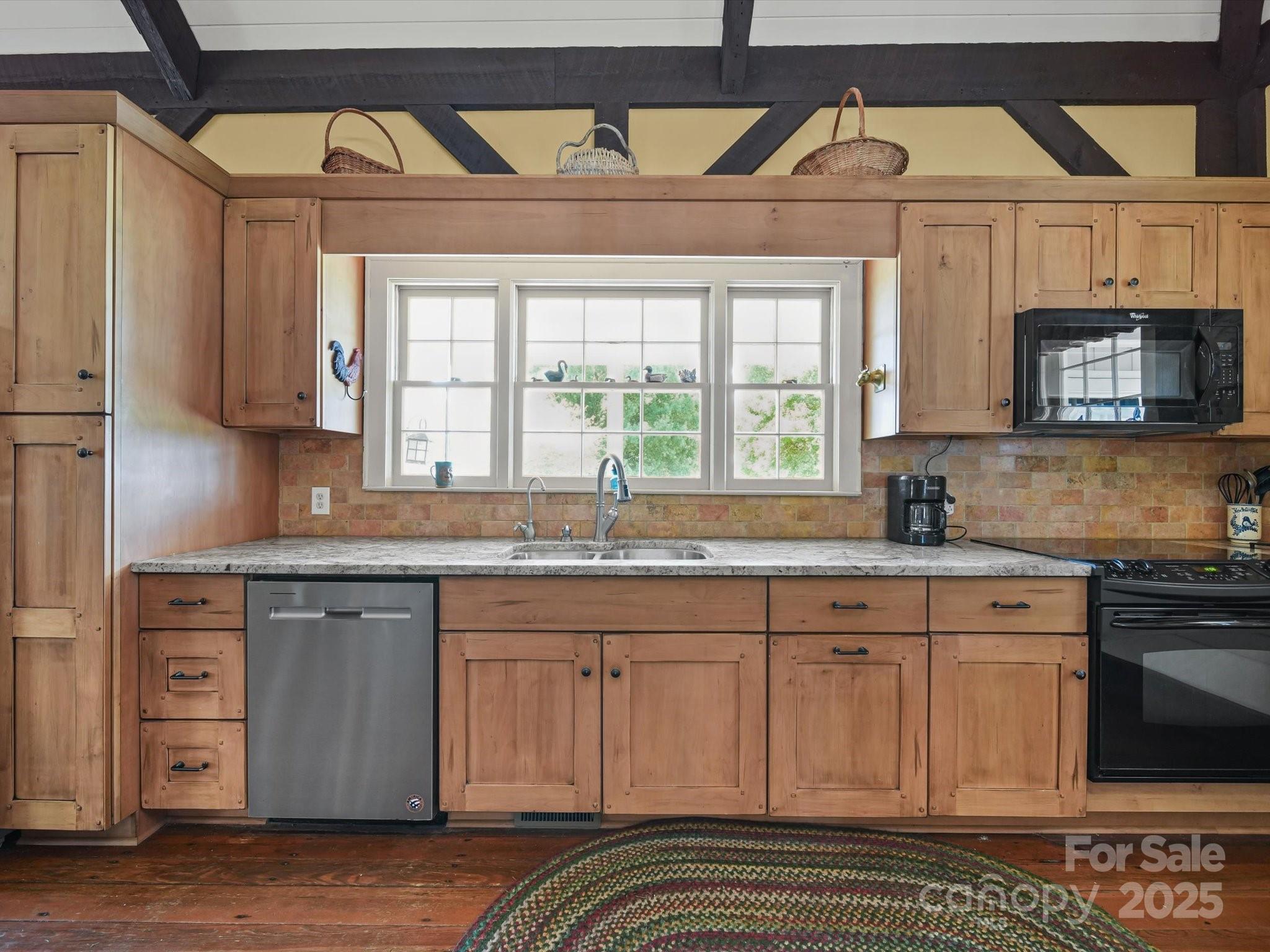 16801 Randalls Ferry Road Norwood, NC 28128 - Photo 22 of 48 a kitchen with stainless steel appliances granite countertop a sink and cabinets