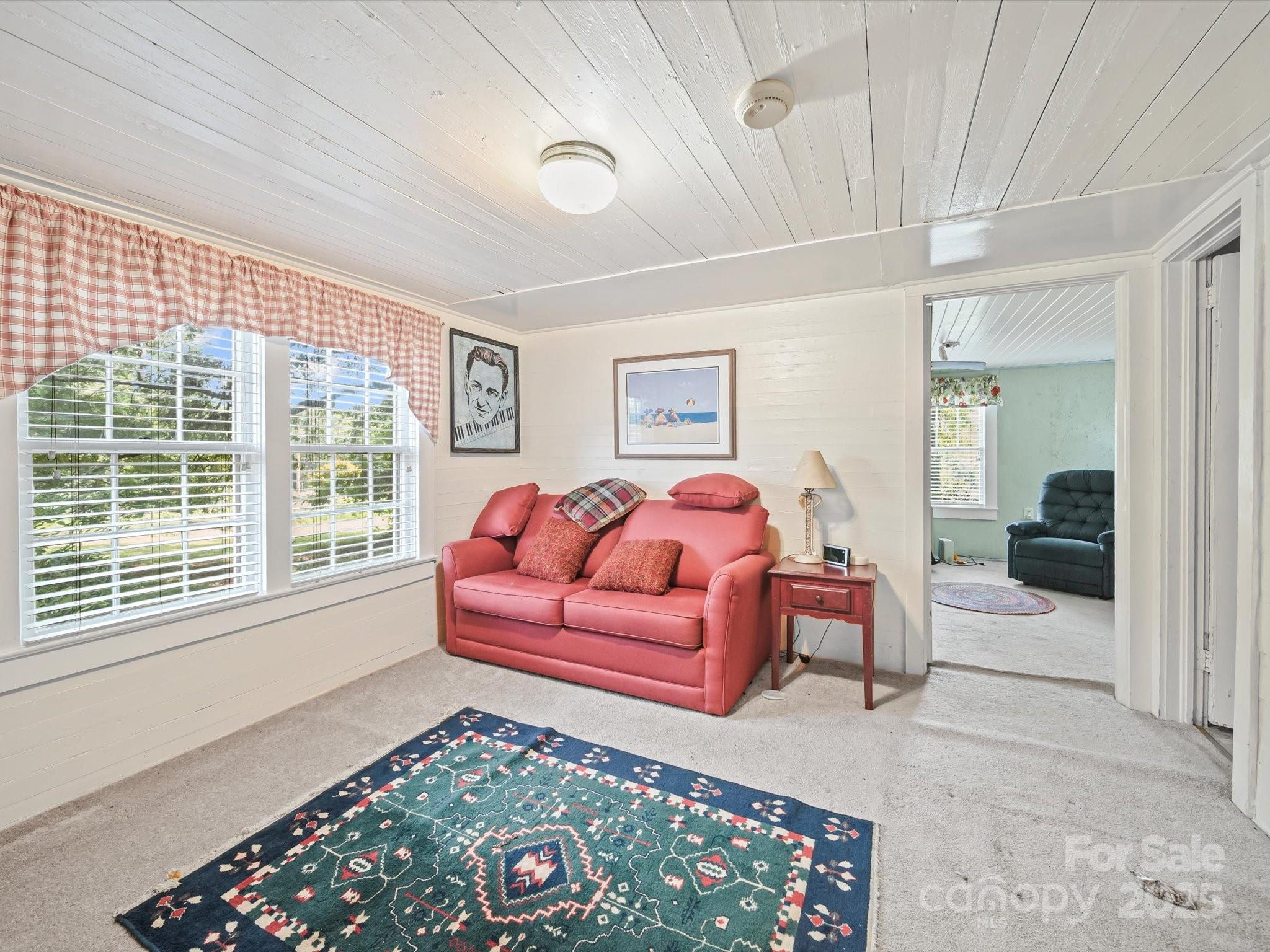 16801 Randalls Ferry Road Norwood, NC 28128 - Photo 42 of 48 a living room with furniture and a rug