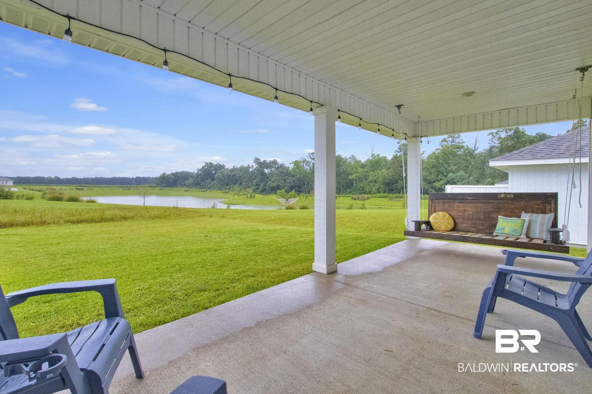 23810 Unbridled Loop Daphne, AL 36526 - Photo 35 of 50 View of patio / terrace with a water view