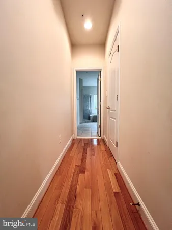 a view of a room with wooden floor and staircase
