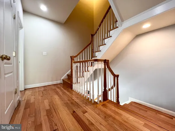 a view of entryway with wooden floor