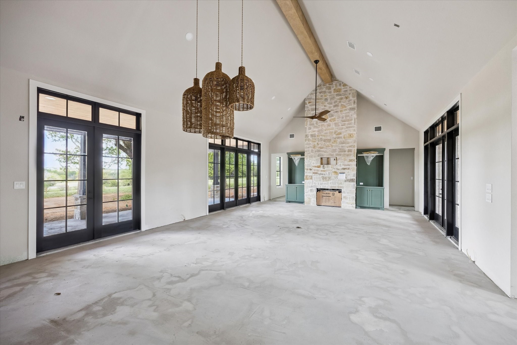 1 Windmill Ridge Brenham, TX 77833 - Photo 11 of 29 a view of an empty room with a fireplace and a large window