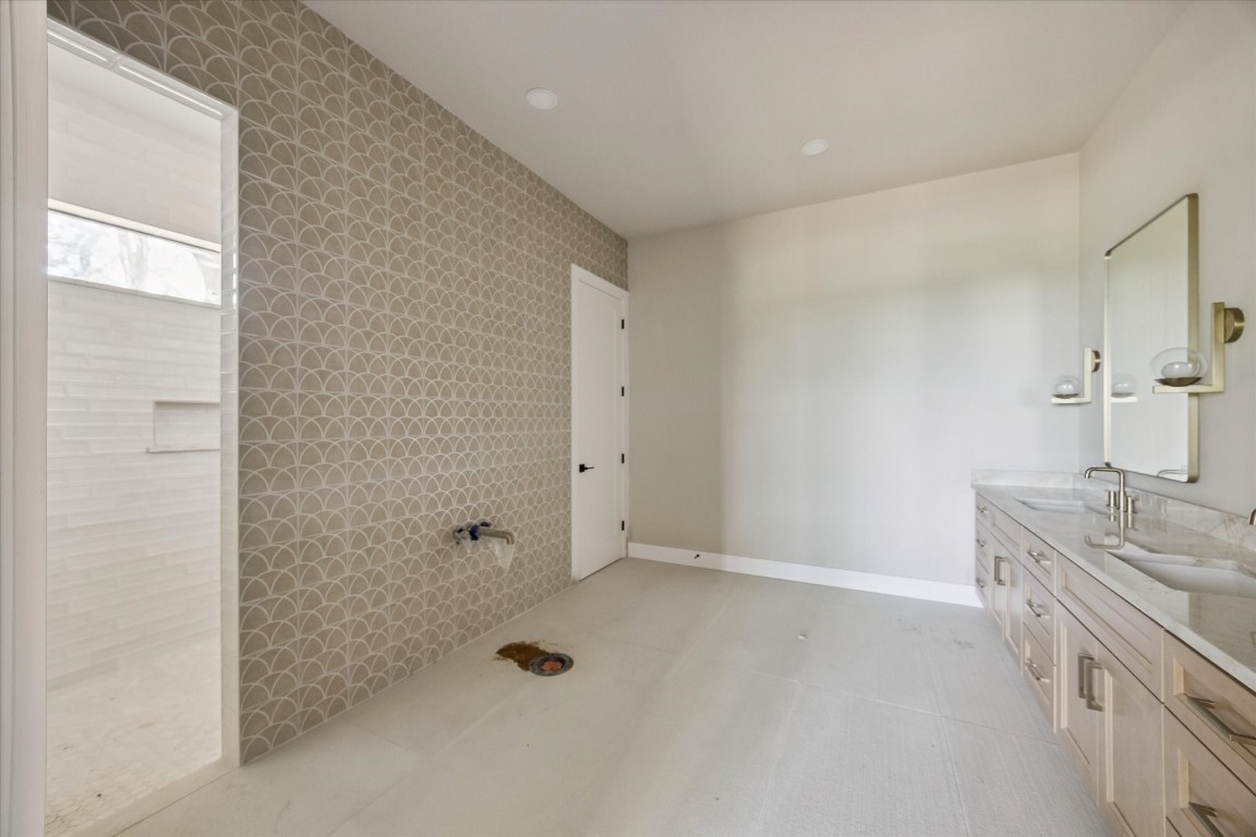 1 Windmill Ridge Brenham, TX 77833 - Photo 13 of 29 Primary bath. Sconce lighting. Lots of storage. Freestanding tub coming soon.