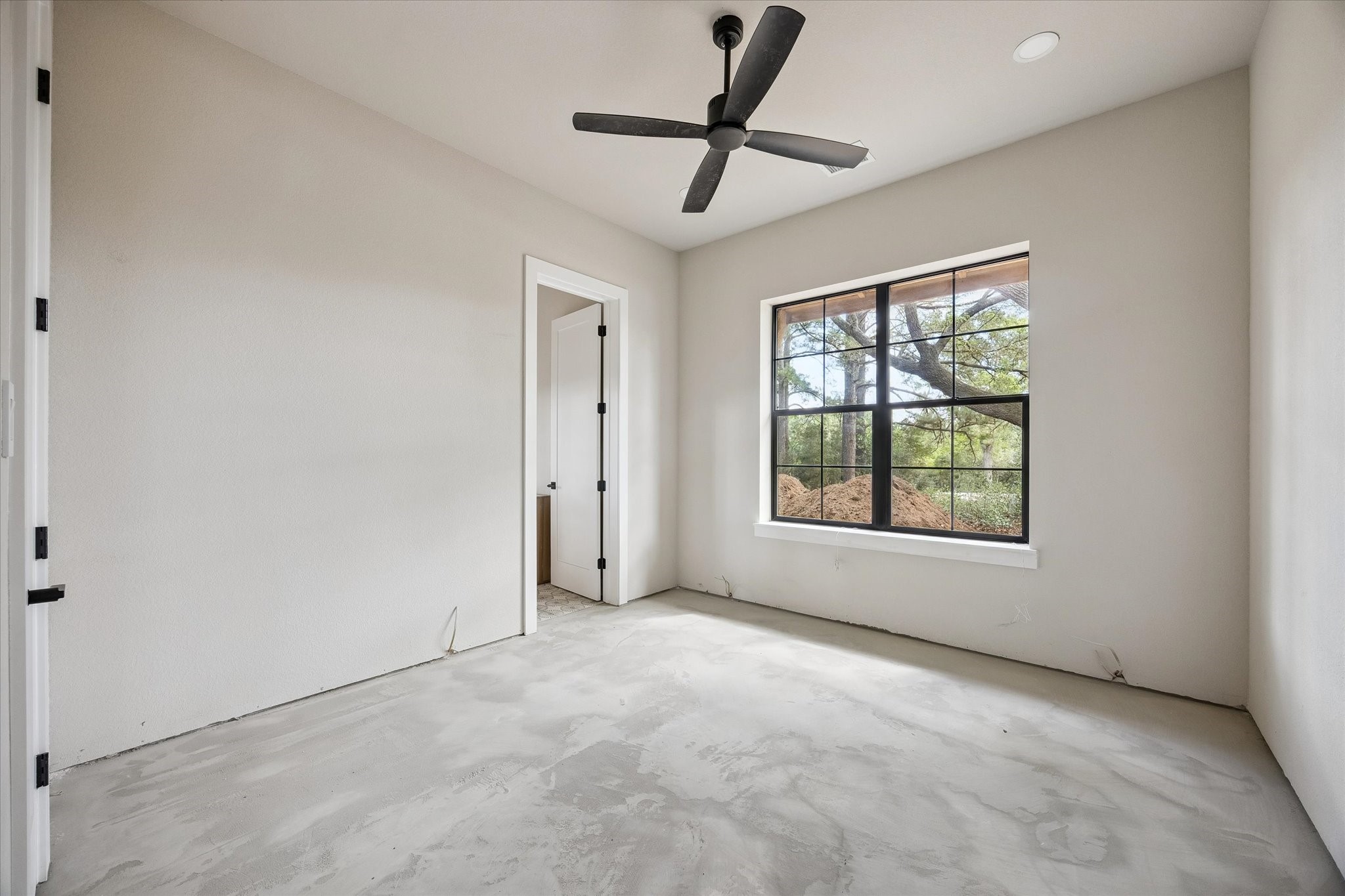 1 Windmill Ridge Brenham, TX 77833 - Photo 15 of 29 a view of a livingroom with a ceiling fan and window