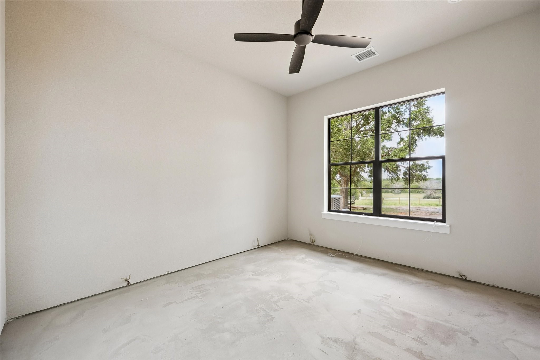 1 Windmill Ridge Brenham, TX 77833 - Photo 17 of 29 an empty room with a window