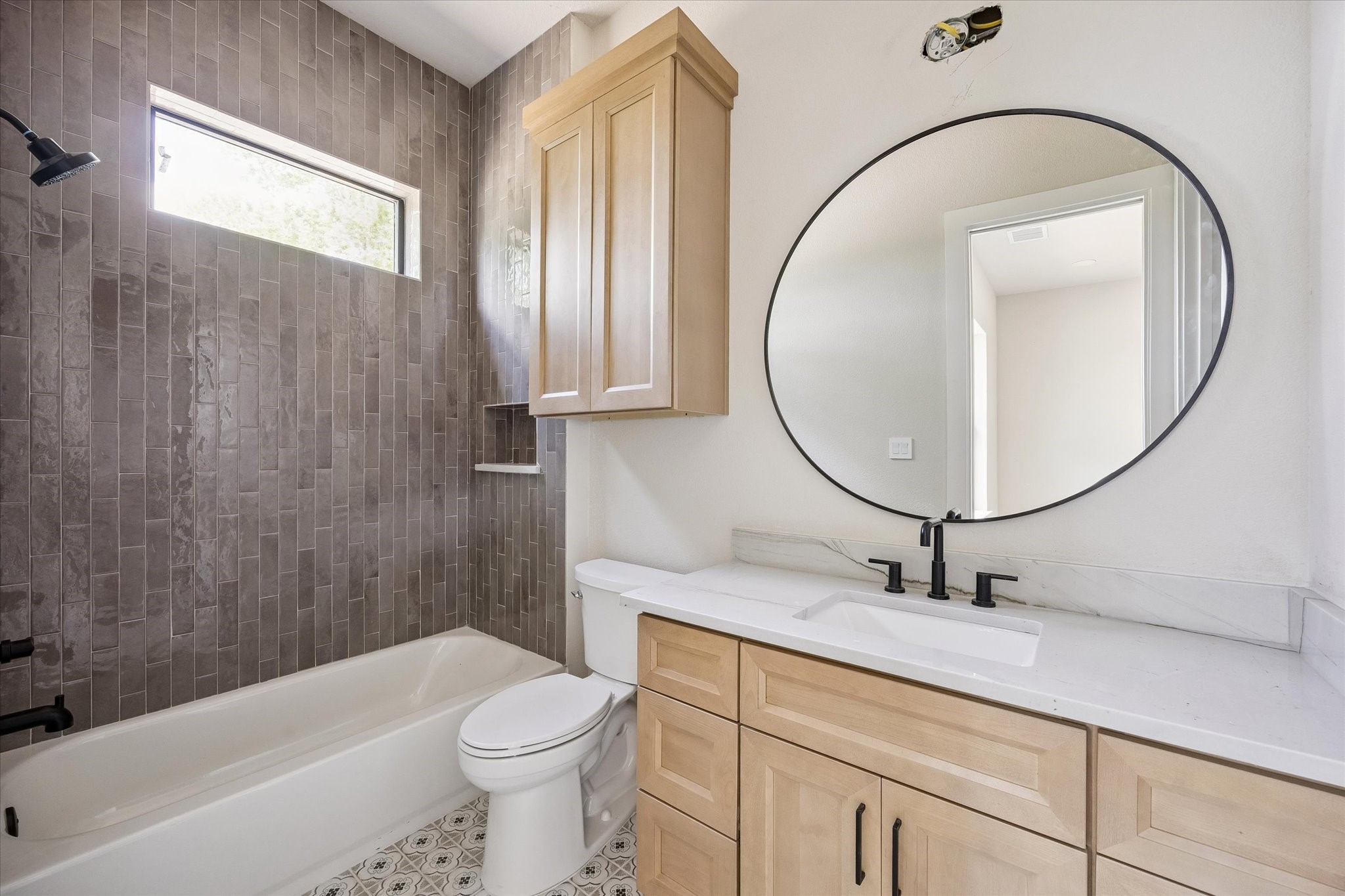 1 Windmill Ridge Brenham, TX 77833 - Photo 18 of 29 a bathroom with a sink a toilet and a mirror
