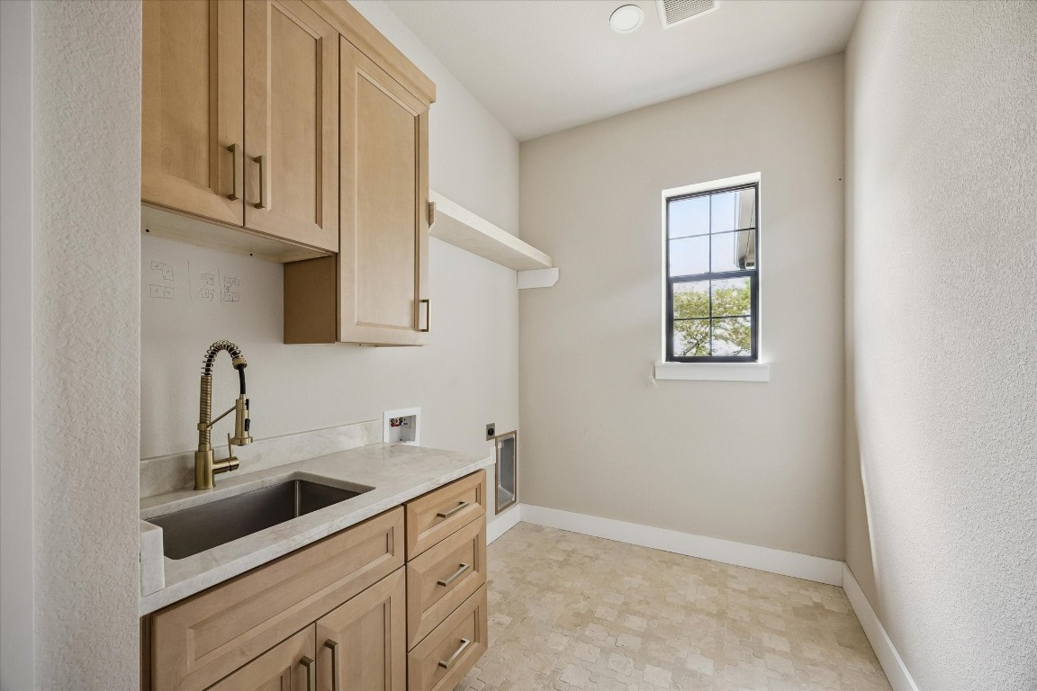 1 Windmill Ridge Brenham, TX 77833 - Photo 21 of 29 Laundry room with sink and storage closet.