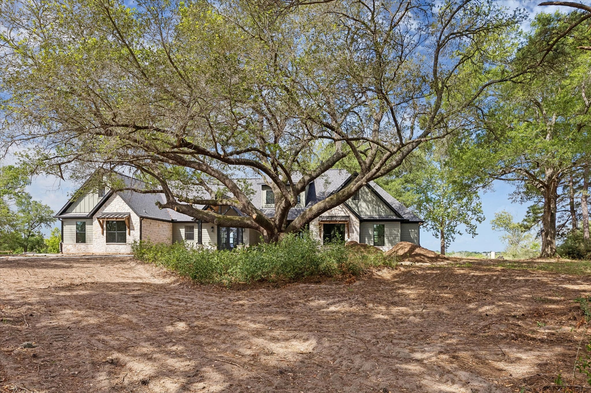 1 Windmill Ridge Brenham, TX 77833 - Photo 3 of 29 a front view of a house with a tree in front