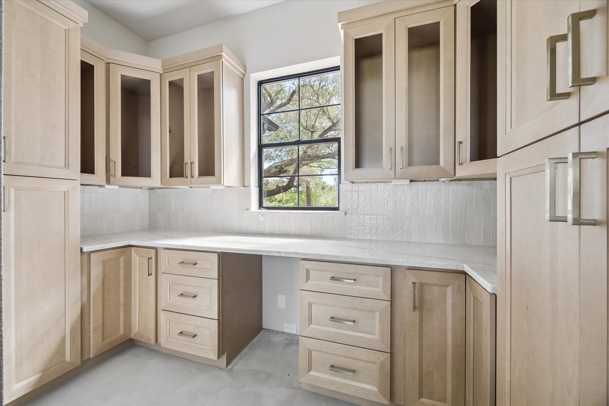 1 Windmill Ridge Brenham, TX 77833 - Photo 5 of 29 a kitchen with granite countertop a window and cabinets