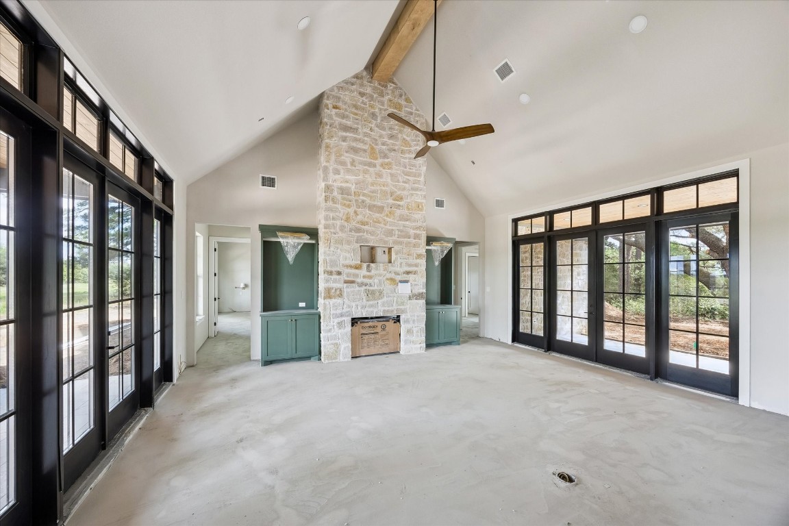 1 Windmill Ridge Brenham, TX 77833 - Photo 7 of 29 One big great room. Vaulted ceiling, maple beam, beautiful French doors with transoms above.