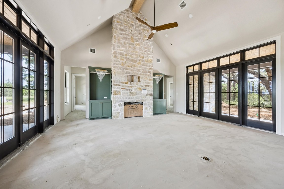 1 Windmill Ridge Brenham, TX 77833 - Photo 8 of 29 Stone on fireplace to ceiling with built-ins with lighting on either side.