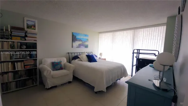 a bed room with a bed and window
