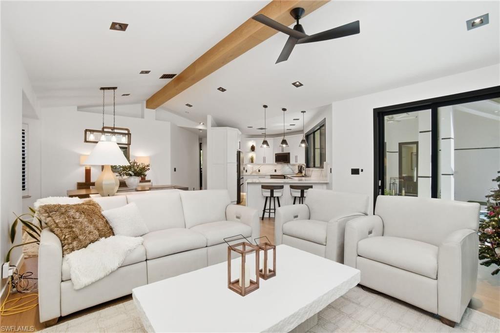 1506 Jewel Naples, FL 34102 - Photo 18 of 49 a living room with furniture and a chandelier