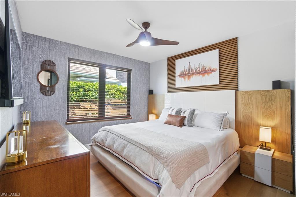 1506 Jewel Naples, FL 34102 - Photo 23 of 49 a bedroom with a bed and a large window
