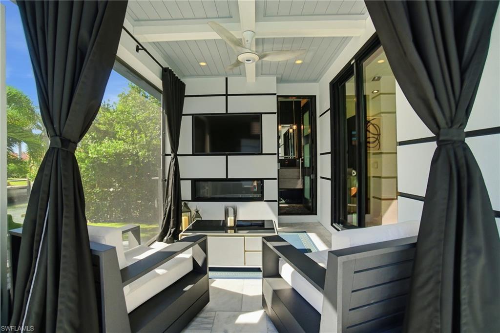 1506 Jewel Naples, FL 34102 - Photo 27 of 49 a living room with furniture stove and a large window