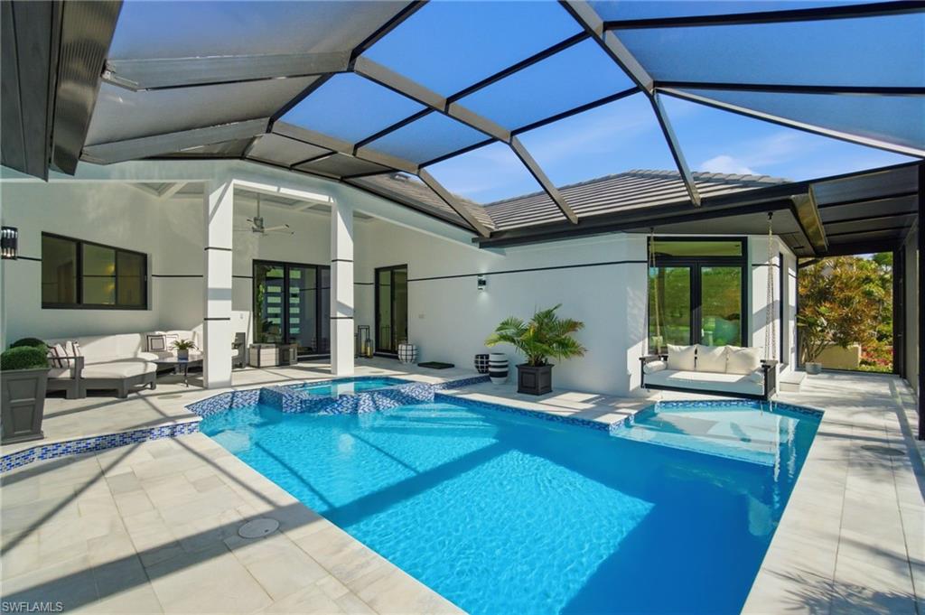 1506 Jewel Naples, FL 34102 - Photo 31 of 49 a swimming pool with outdoor seating and yard