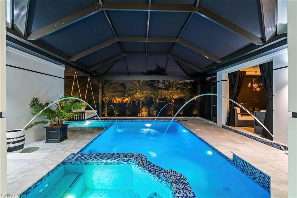 1506 Jewel Naples, FL 34102 - Photo 34 of 49 a view of a swimming pool with a patio