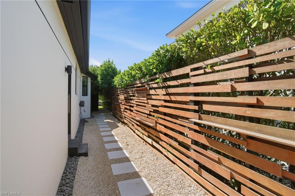 1506 Jewel Naples, FL 34102 - Photo 36 of 49 a view of a balcony with wooden floor and potted plants