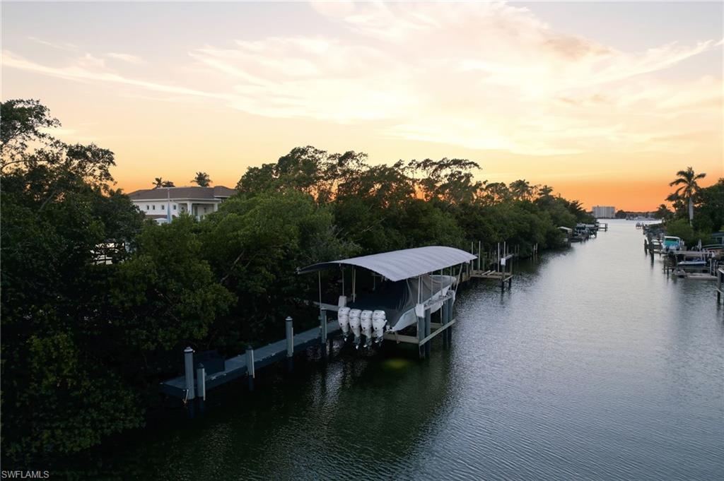 1506 Jewel Naples, FL 34102 - Photo 47 of 49 a view of a lake with outdoor seating