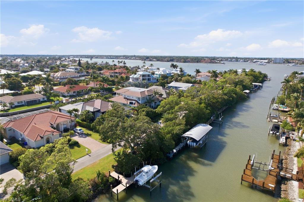 1506 Jewel Naples, FL 34102 - Photo 48 of 49 an aerial view of a city with lots of residential buildings ocean and mountain view in back