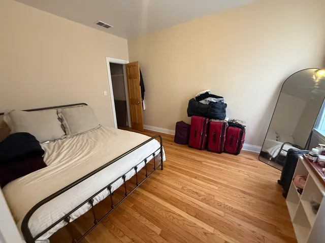a bedroom with bed and window