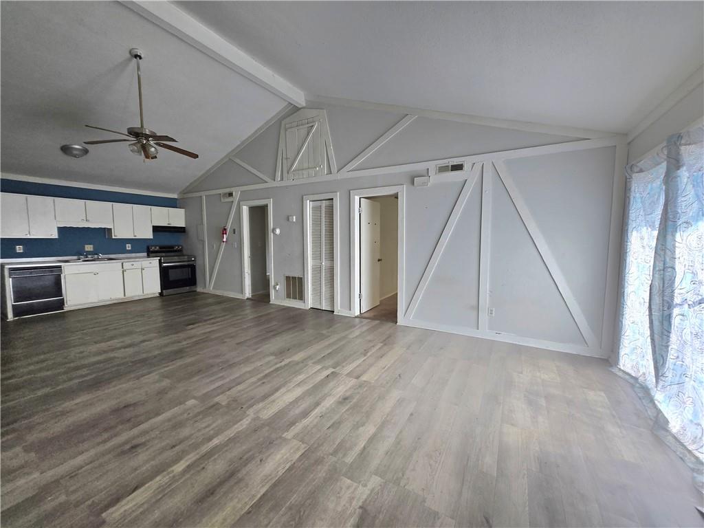 4701 Flat Shoals Road, Unit 67D Union City, GA 30291 - Photo 6 of 13 a view of a livingroom with a kitchen and a stove top oven