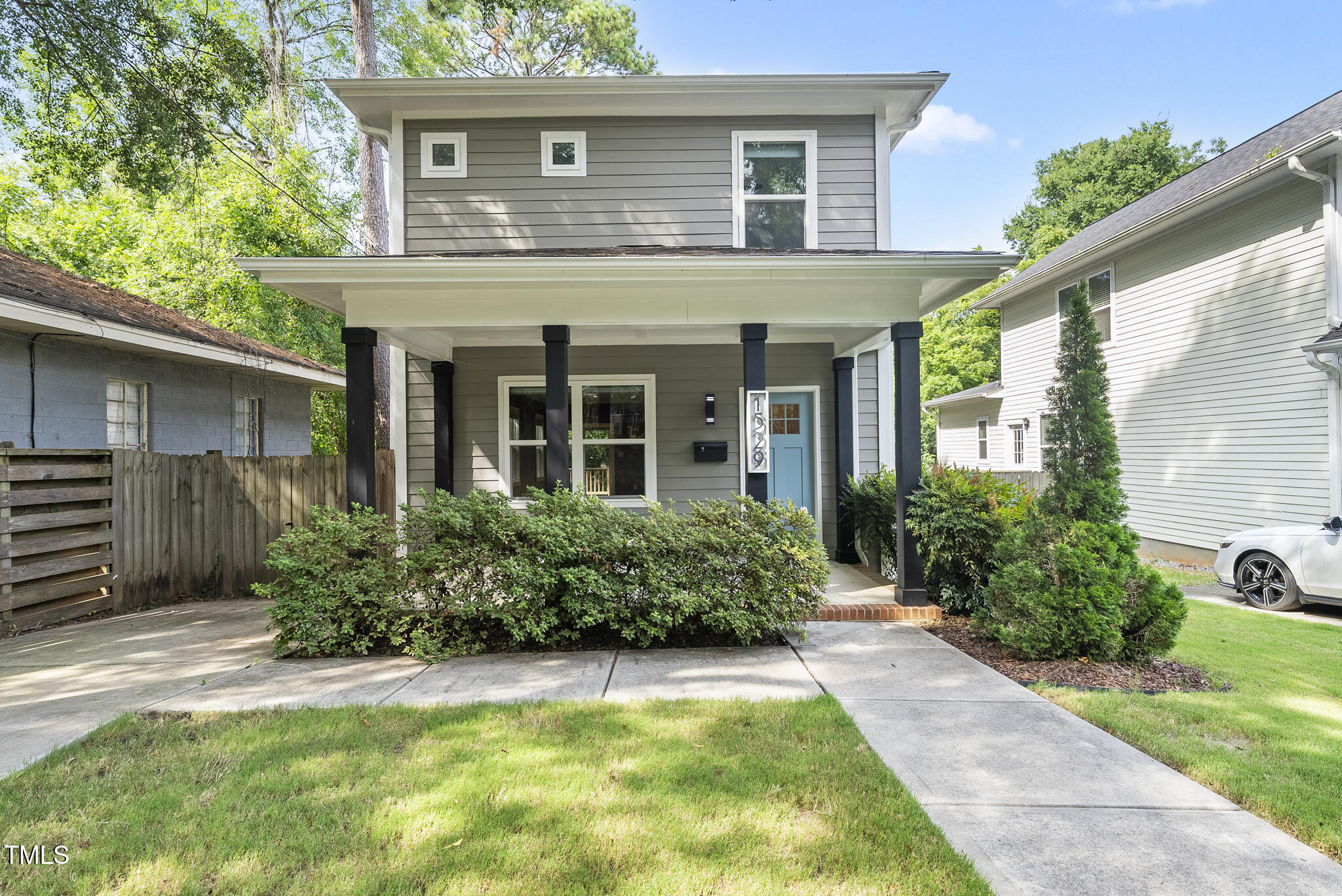 1529 Battery Drive Raleigh, NC 27610 - Photo 1 of 34 a view of a house with potted plants and a table and chairs