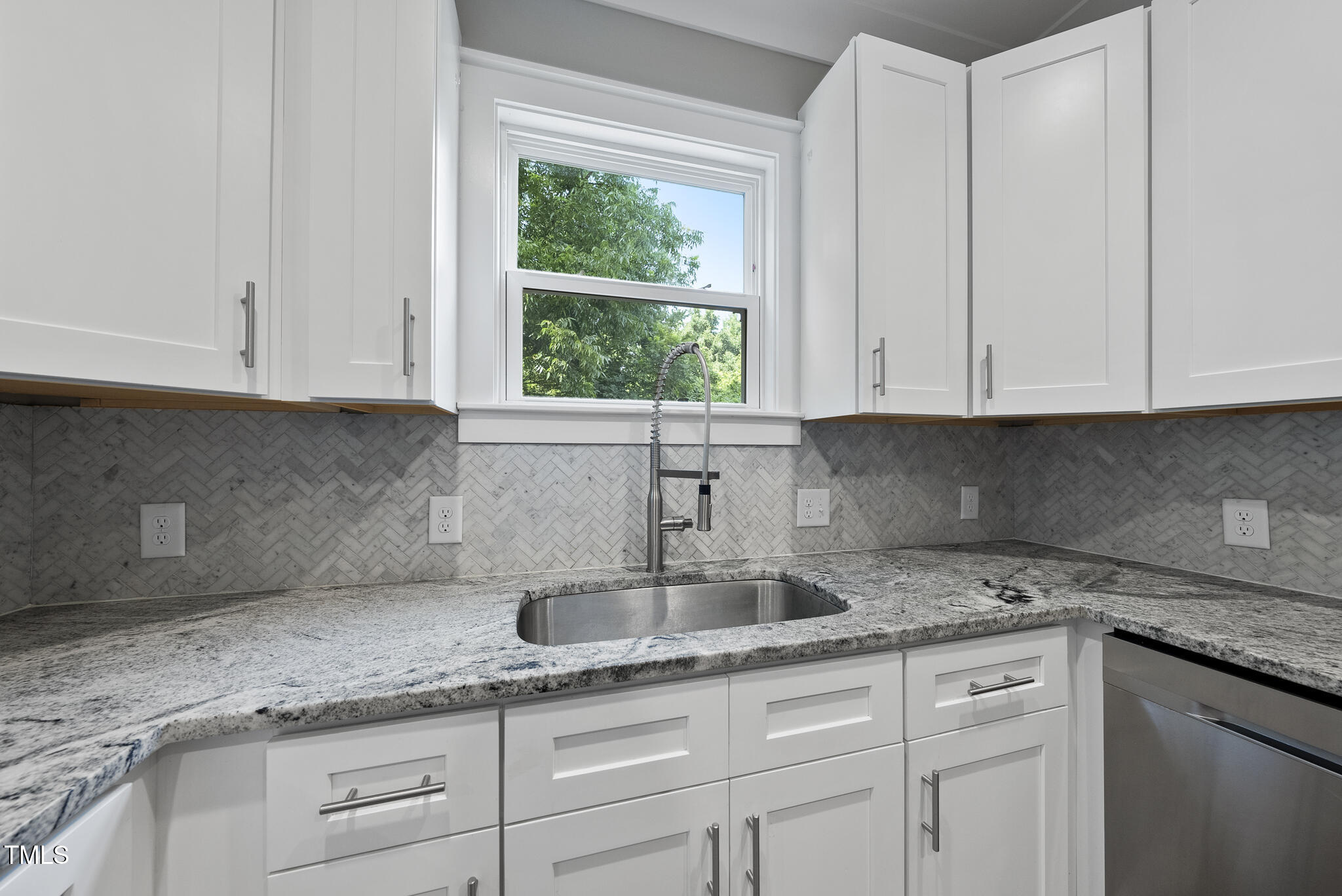 1529 Battery Drive Raleigh, NC 27610 - Photo 12 of 34 a kitchen with granite countertop white cabinets white appliances and a sink