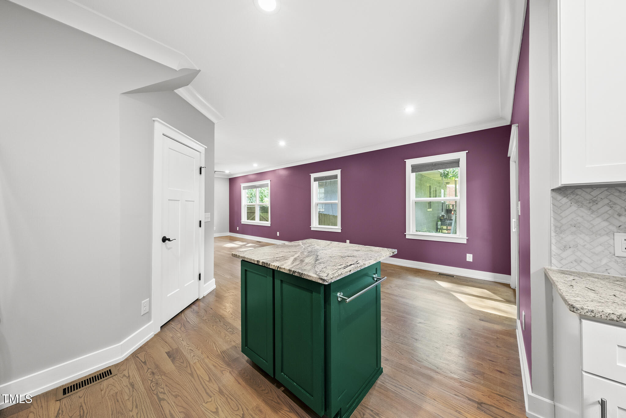 1529 Battery Drive Raleigh, NC 27610 - Photo 13 of 34 a kitchen with granite countertop sink stove and cabinets