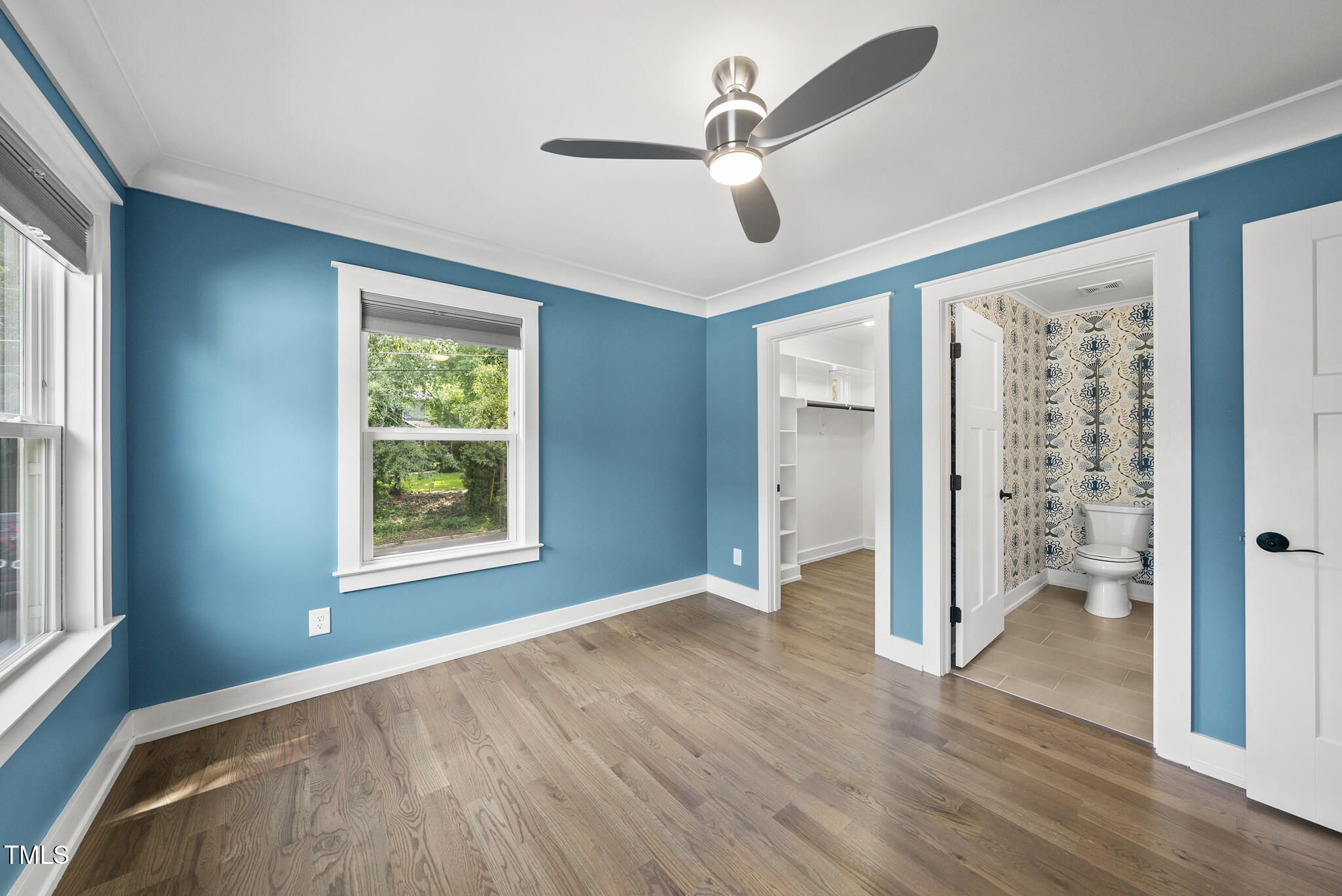 1529 Battery Drive Raleigh, NC 27610 - Photo 15 of 34 a view of an empty room with a window and wooden floor