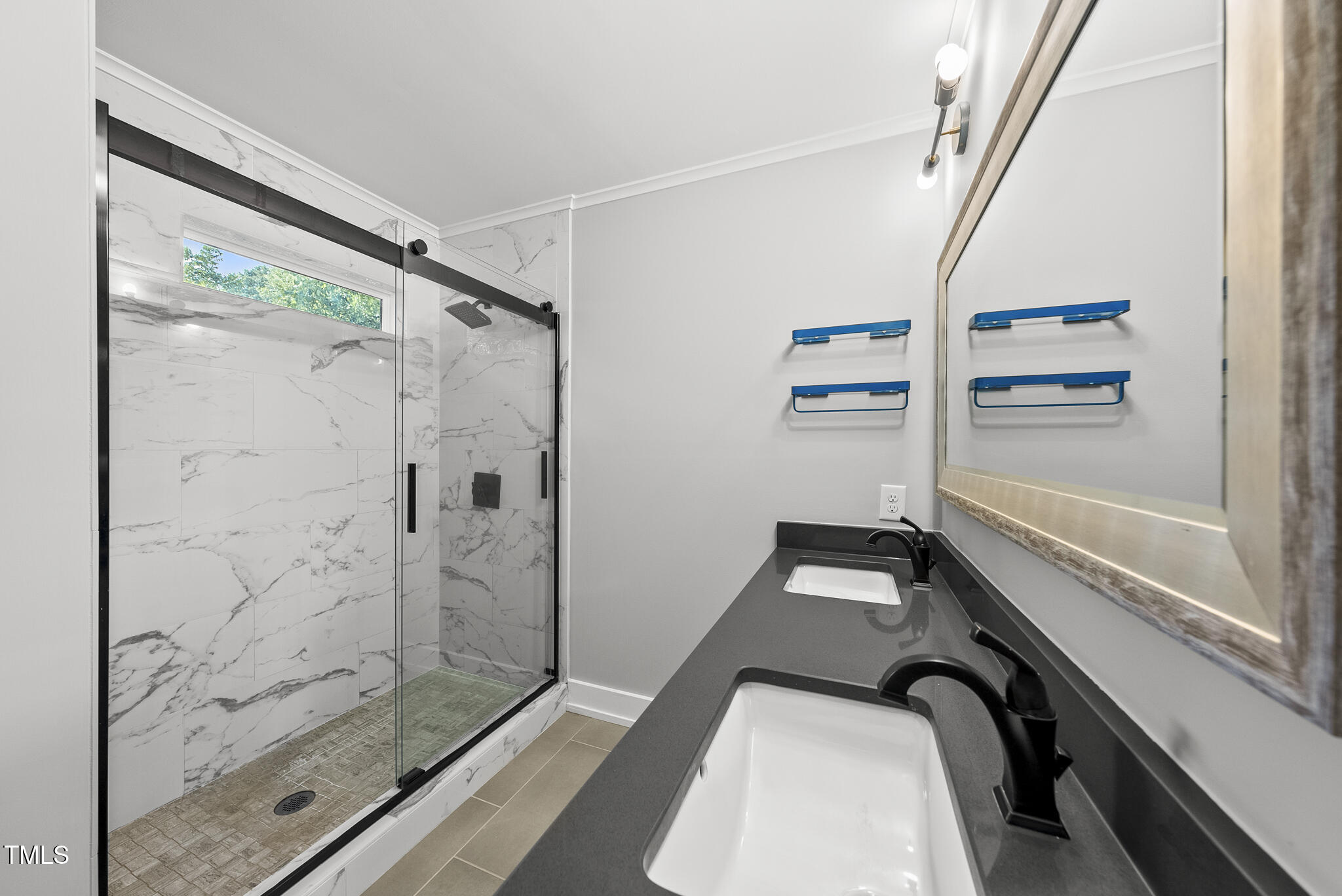 1529 Battery Drive Raleigh, NC 27610 - Photo 19 of 34 a bathroom with a shower and a mirror