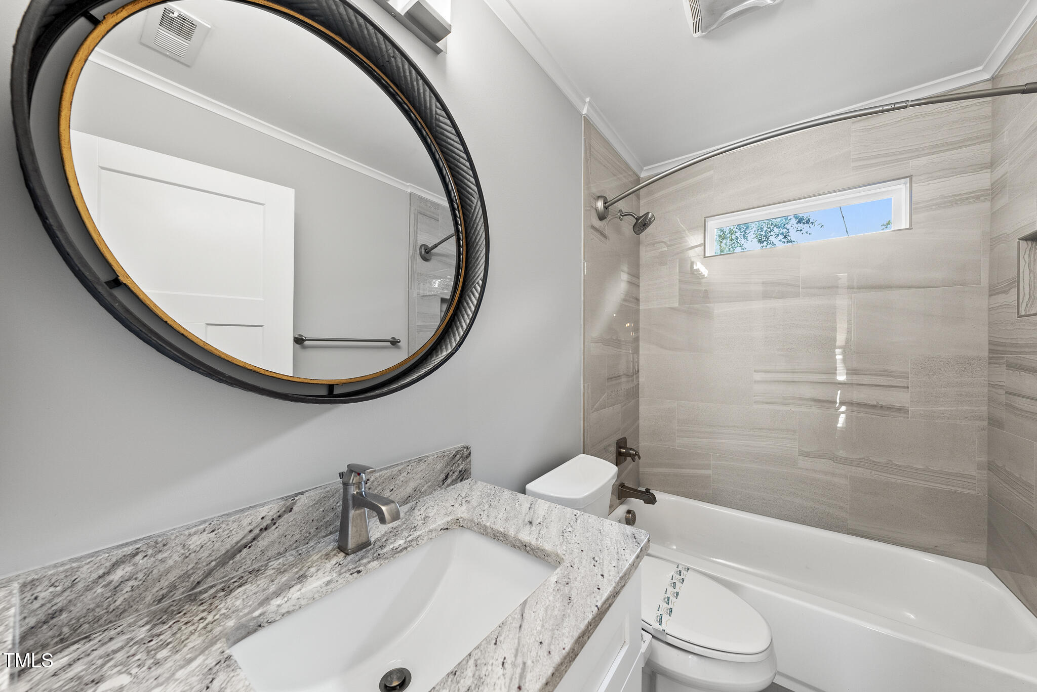 1529 Battery Drive Raleigh, NC 27610 - Photo 22 of 34 a bathroom with a granite countertop sink toilet and a mirror