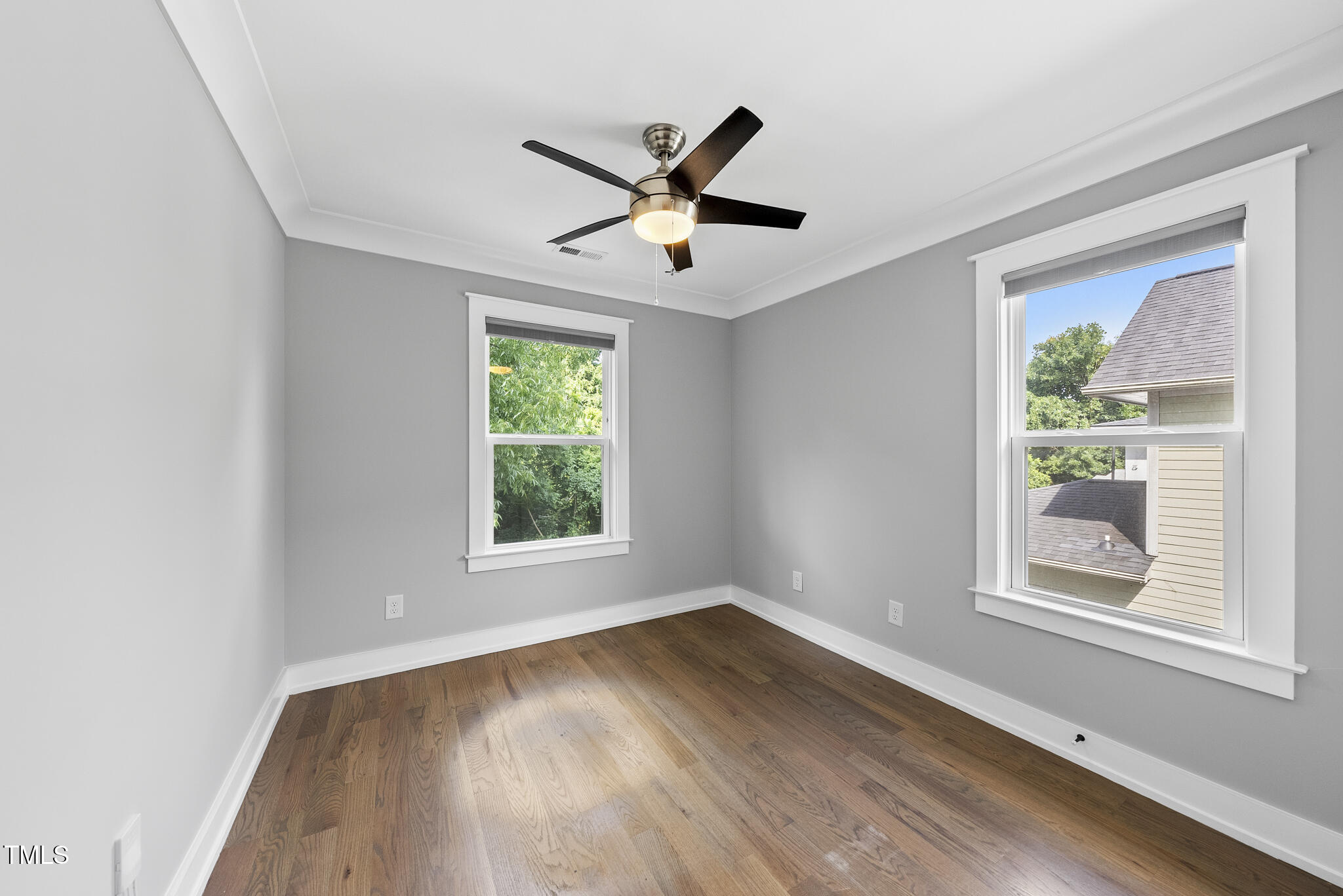 1529 Battery Drive Raleigh, NC 27610 - Photo 24 of 34 wooden floor in an empty room with a window