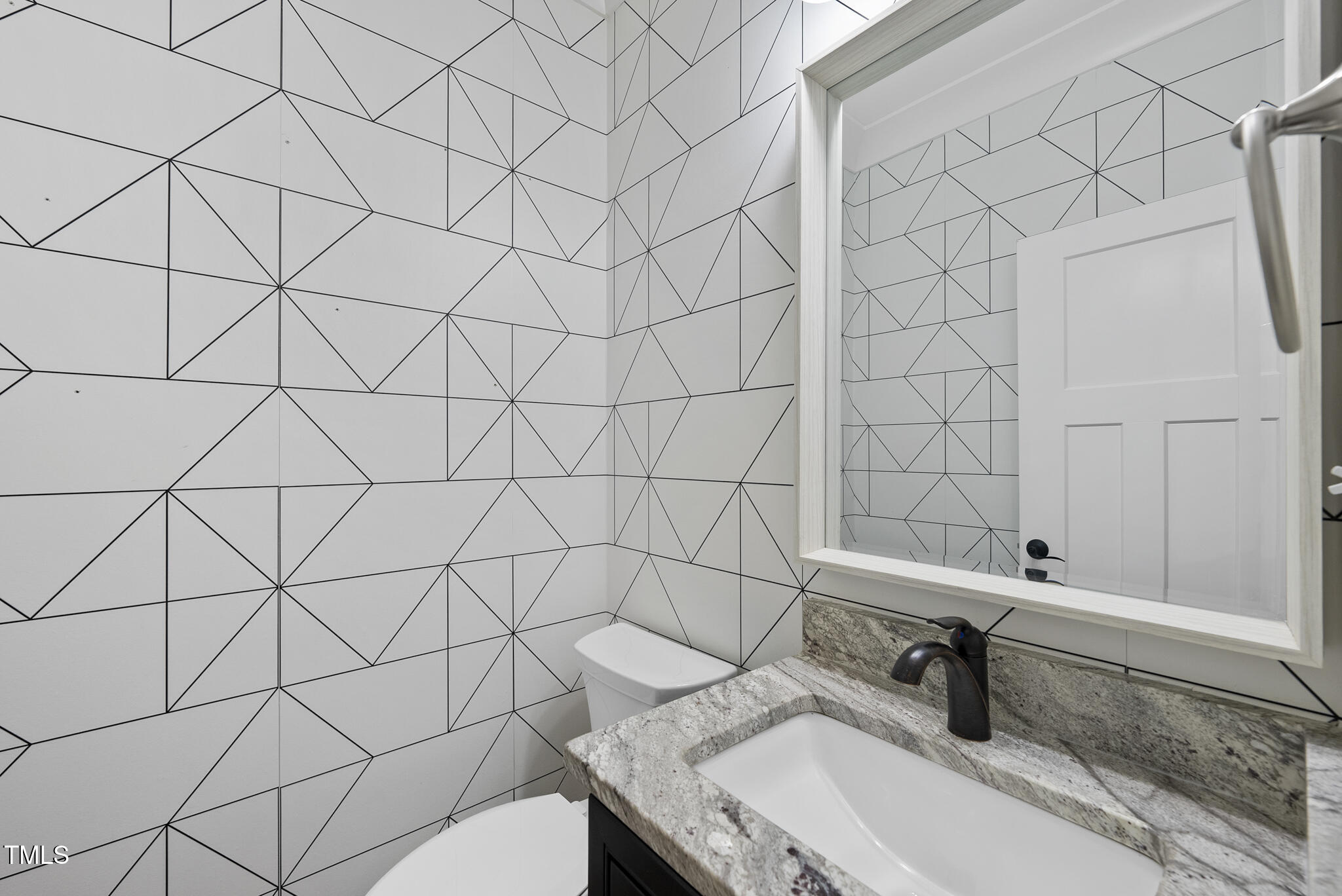 1529 Battery Drive Raleigh, NC 27610 - Photo 25 of 34 a bathroom with a sink and a toilet