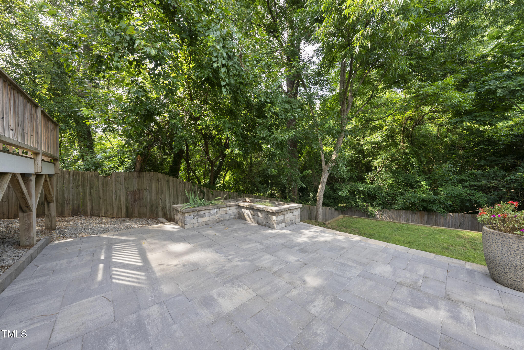 1529 Battery Drive Raleigh, NC 27610 - Photo 29 of 34 a view of backyard with table and chairs a barbeque and trees