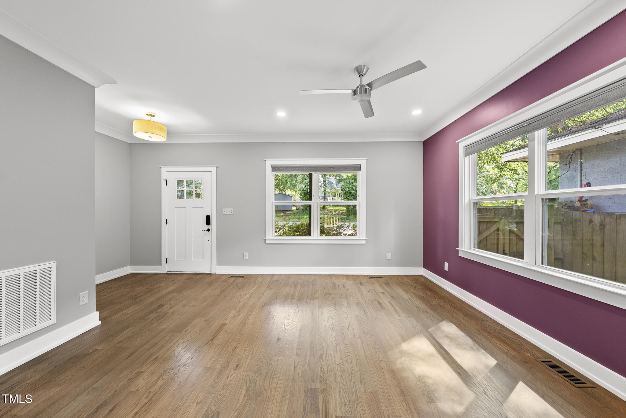 1529 Battery Drive Raleigh, NC 27610 - Photo 4 of 34 a view of an empty room with wooden floor and a window