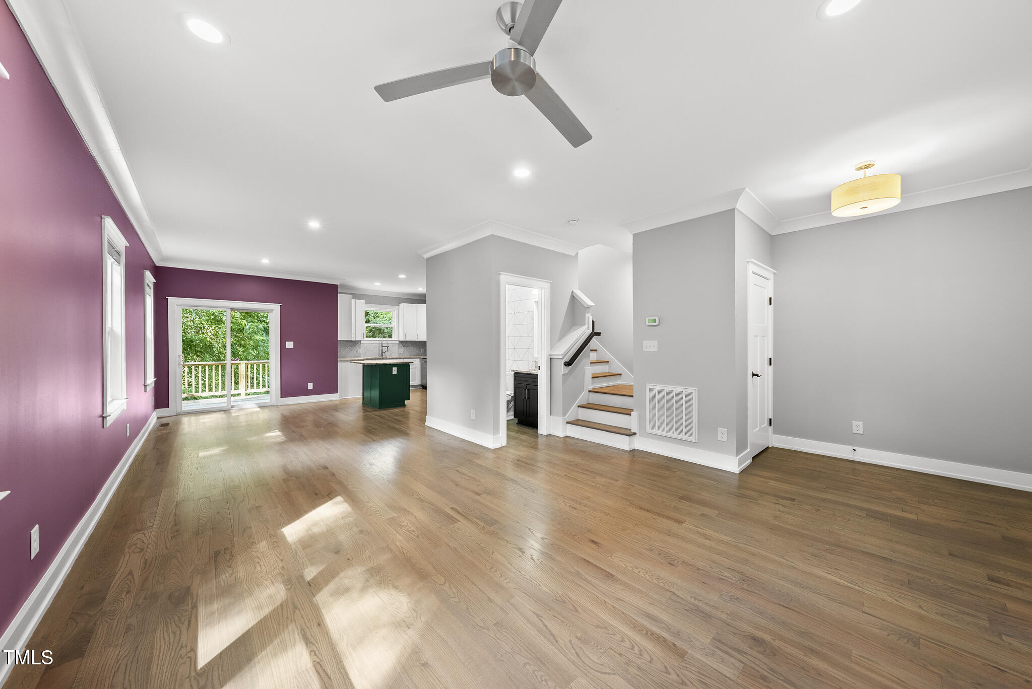 1529 Battery Drive Raleigh, NC 27610 - Photo 5 of 34 a view of an empty room with wooden floor and a window