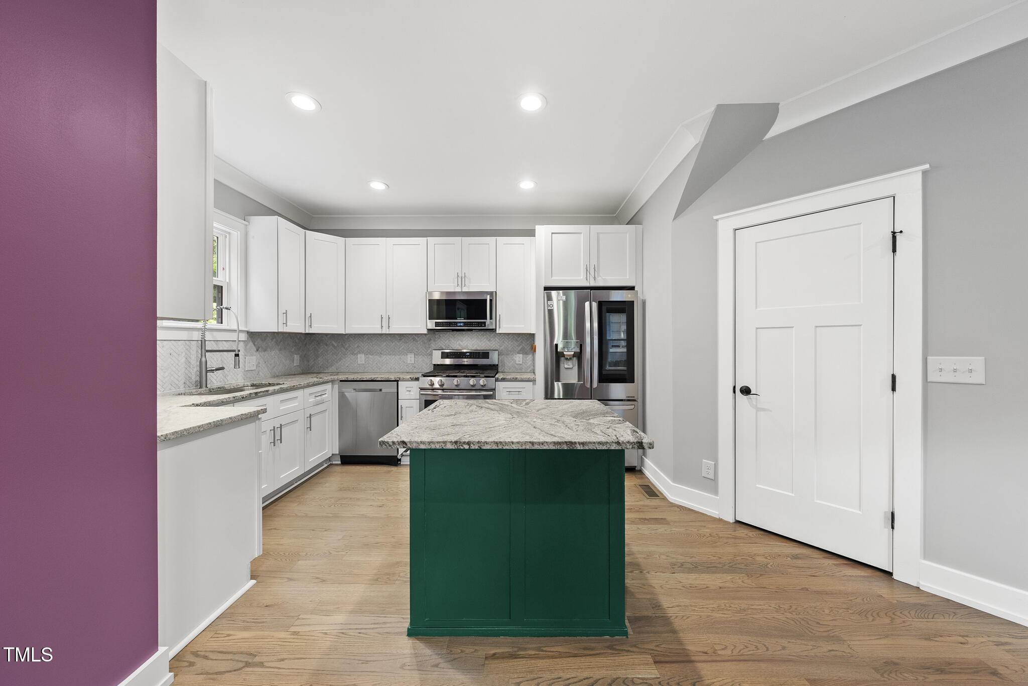 1529 Battery Drive Raleigh, NC 27610 - Photo 9 of 34 a large kitchen with granite countertop a large counter top stainless steel appliances and cabinets