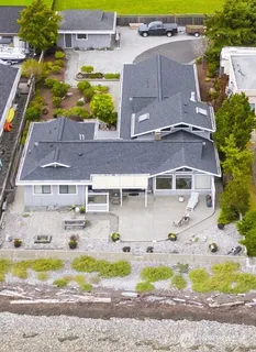 an aerial view of a house with a swimming pool