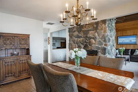 a kitchen with stainless steel appliances granite countertop a stove and a sink
