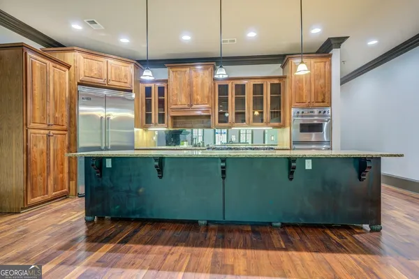 a kitchen with a refrigerator and window