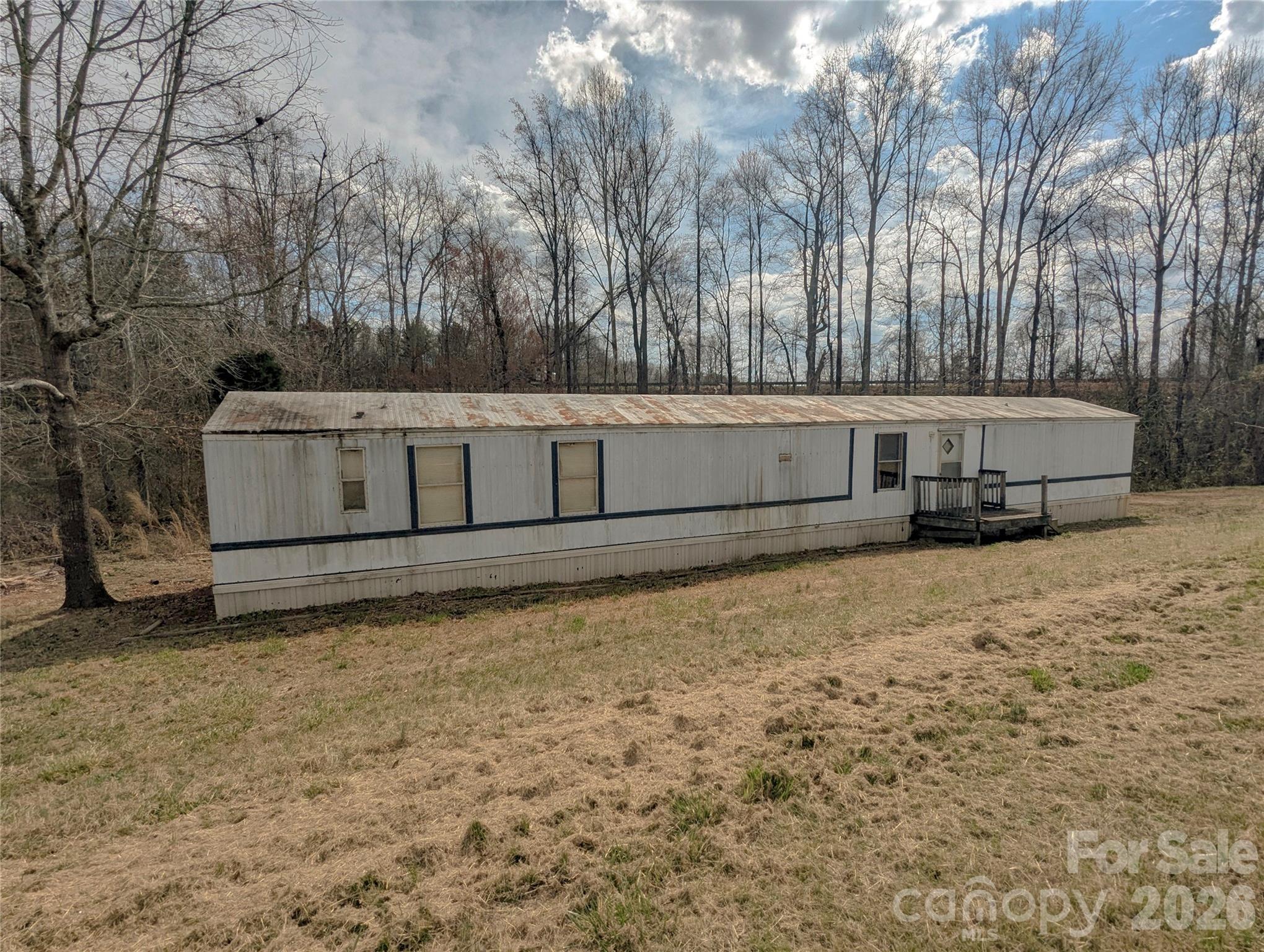565 Jm Lovelace Road Ellenboro, NC 28040 - Photo 1 of 42 a view of a backyard