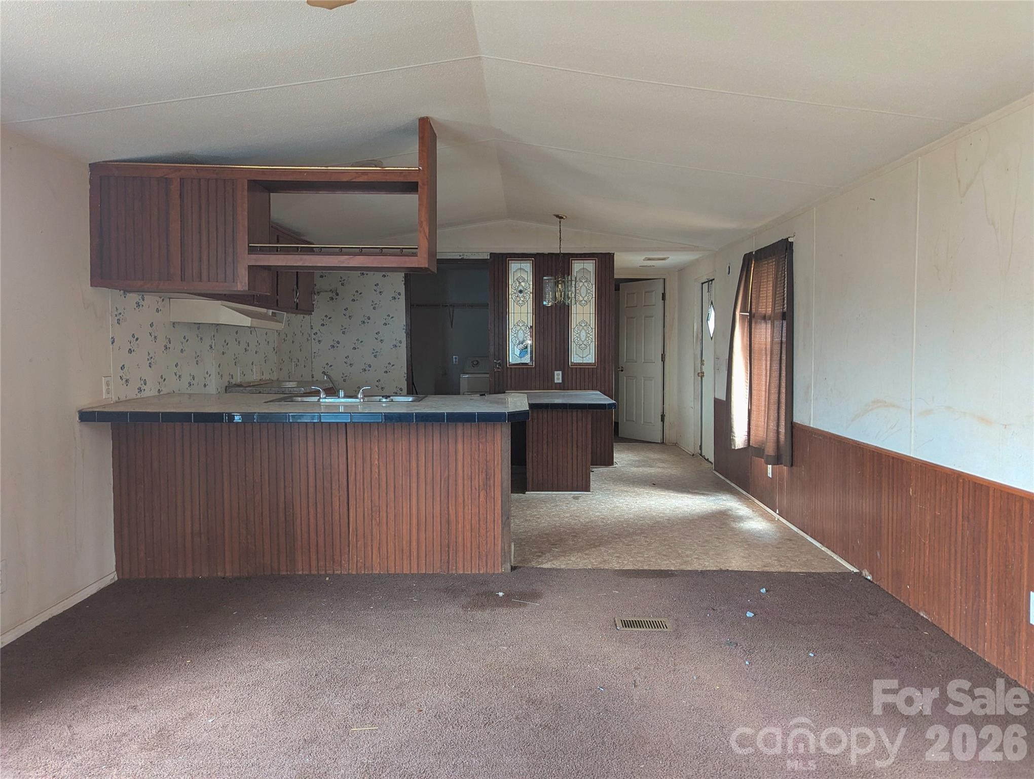 565 Jm Lovelace Road Ellenboro, NC 28040 - Photo 14 of 42 a kitchen with stainless steel appliances granite countertop a sink and a stove
