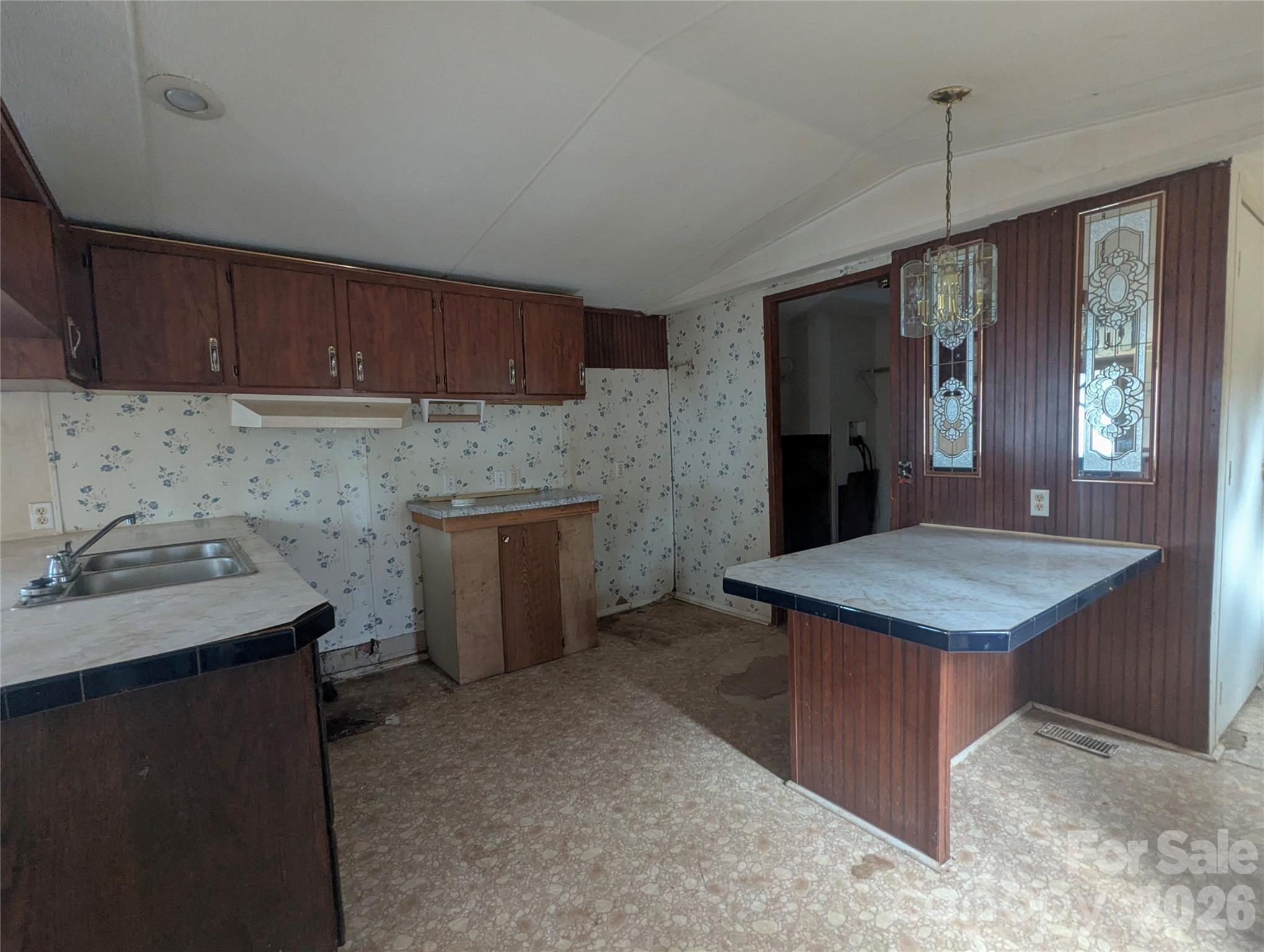 565 Jm Lovelace Road Ellenboro, NC 28040 - Photo 20 of 42 a kitchen with kitchen island a sink stove and refrigerator