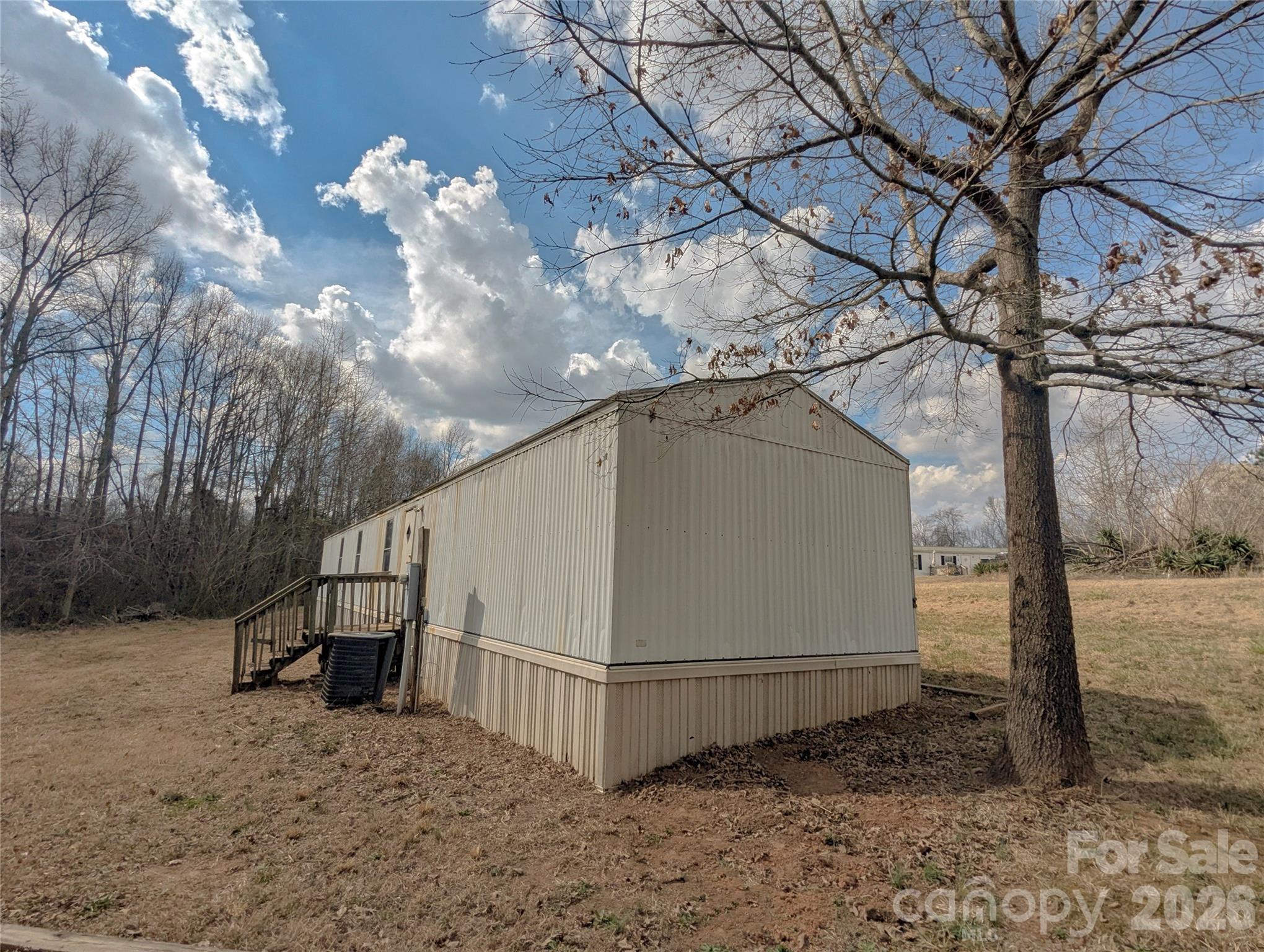 565 Jm Lovelace Road Ellenboro, NC 28040 - Photo 5 of 42 a view of a house with a yard tree s