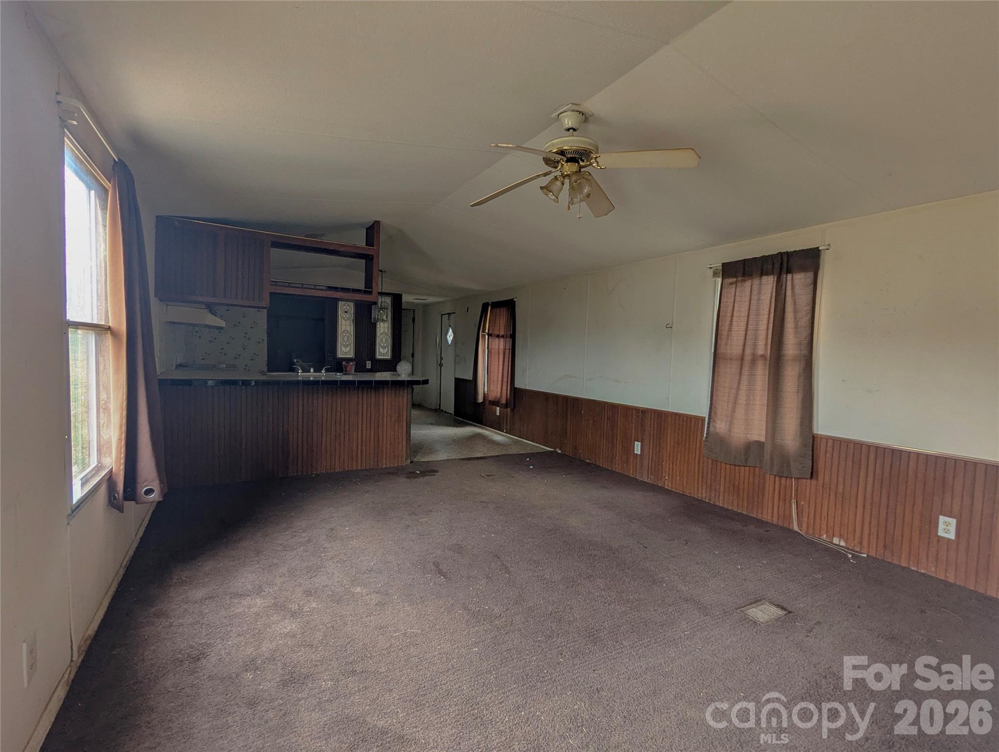 565 Jm Lovelace Road Ellenboro, NC 28040 - Photo 9 of 42 a view of an empty room with a kitchen